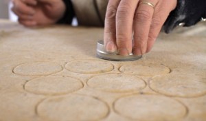 cutting round shapes in the bisket dough